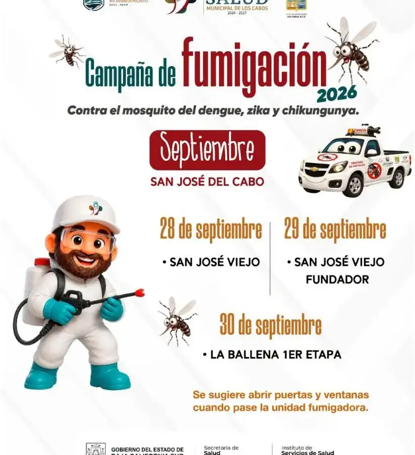 Vehículo fumigador recorriendo una calle residencial durante una jornada contra el dengue