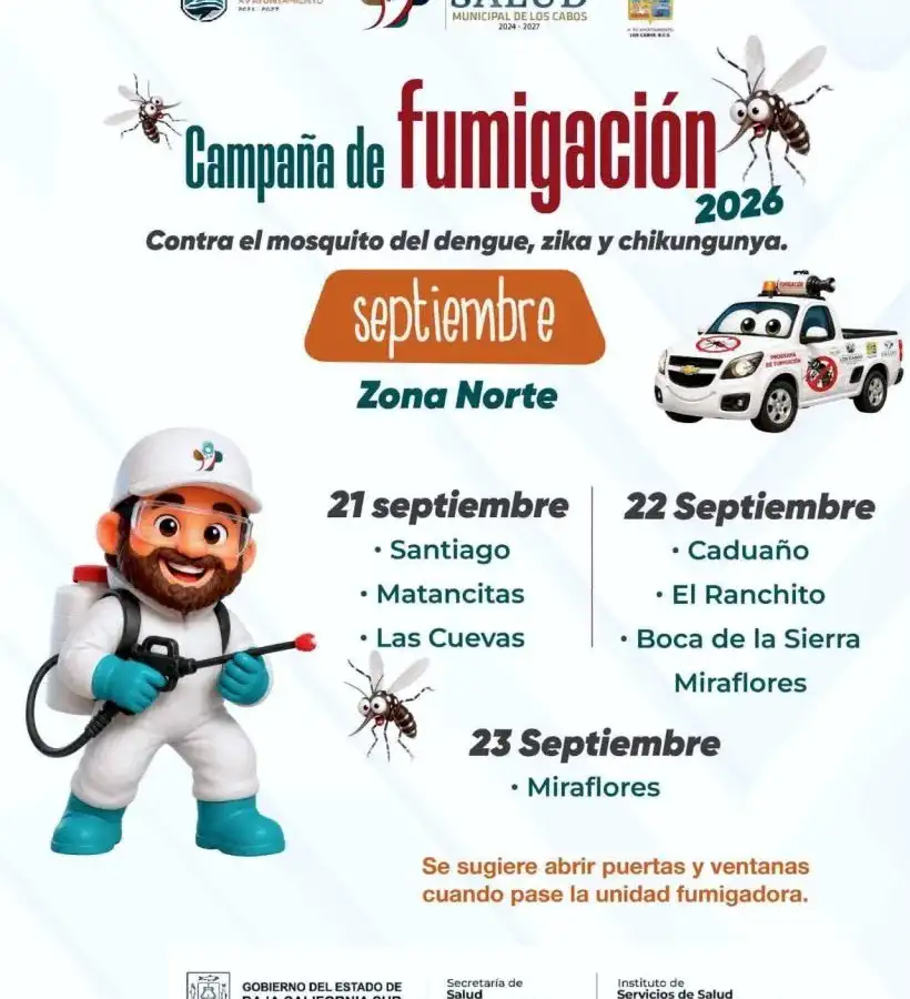 Camioneta fumigadora recorriendo una calle de comunidad rural durante jornada contra el dengue
